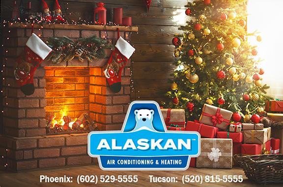 Holiday scene of fireplace with stockings and garland, Christmas tree with presents with Alaskan Air Conditioning and Heating logo and contact phone numbers