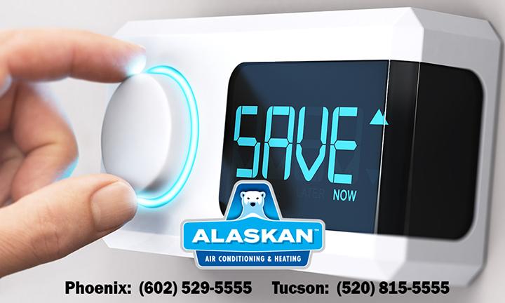 hand turning dial on thermostat reading "save now" with Alaskan Air Conditioning and Heating logo and contact phone numbers