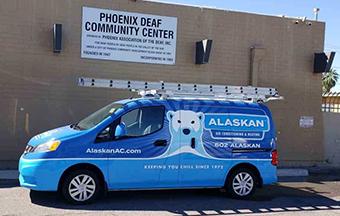 branded Alaskan van in front of building "phoenix deaf community center"