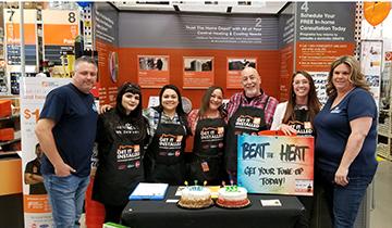 Alaskan team at booth at Home Depot receiving top service provider award 2018