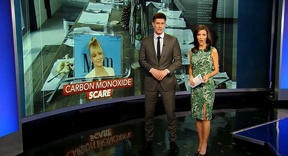 News anchors talking with background image of woman and words "carbon monoxide scare"