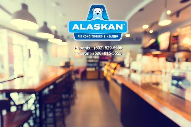 blurry photo of interior of empty coffee shop, Alaskan Air Conditioning and Heating logo and contact phone numbers across top middle