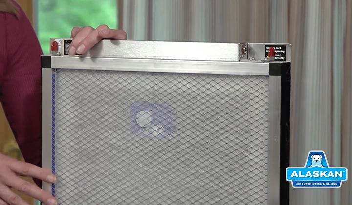 hands holding air filter